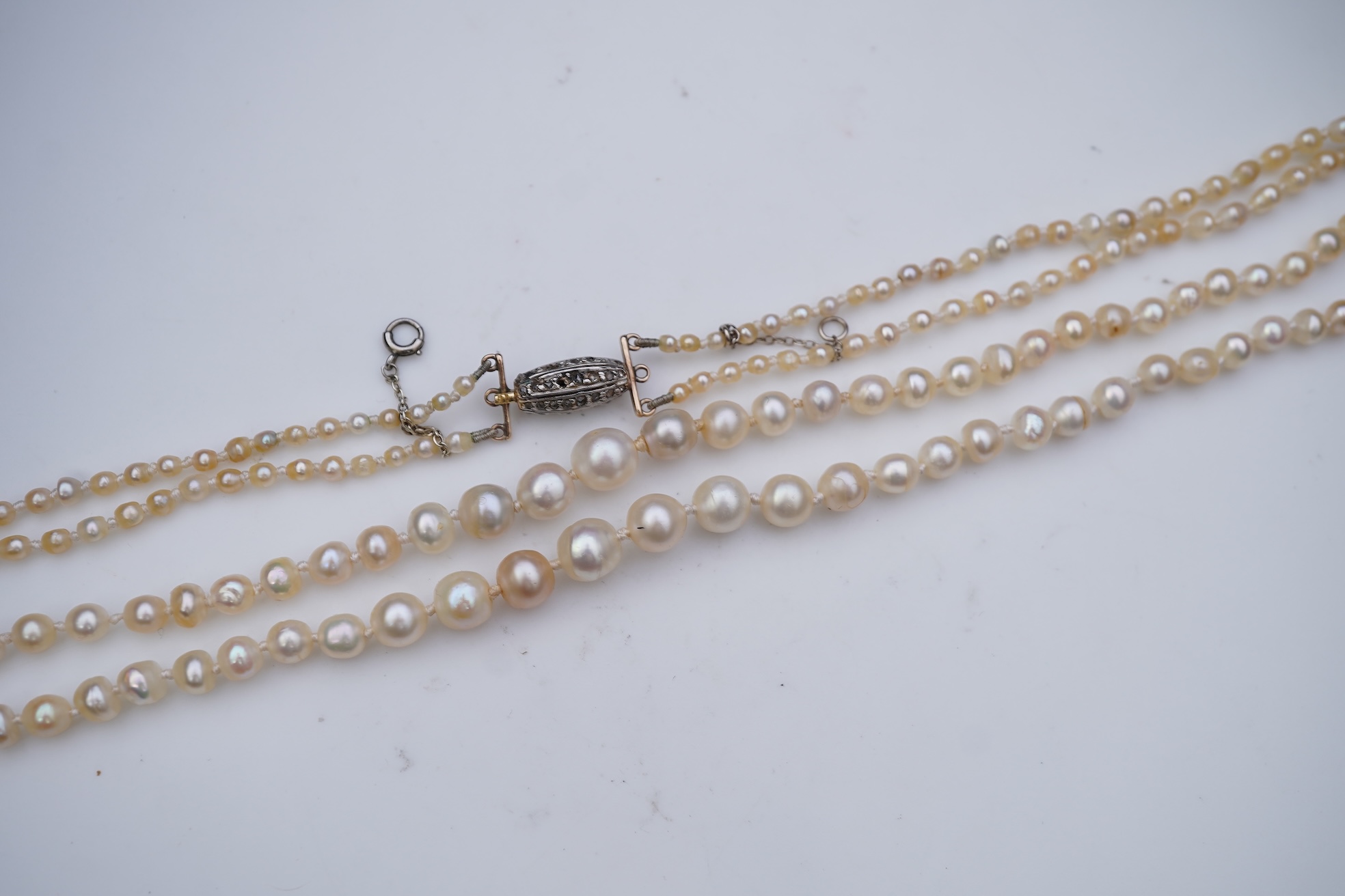 A natural pearl and diamond necklace, early 20th century
